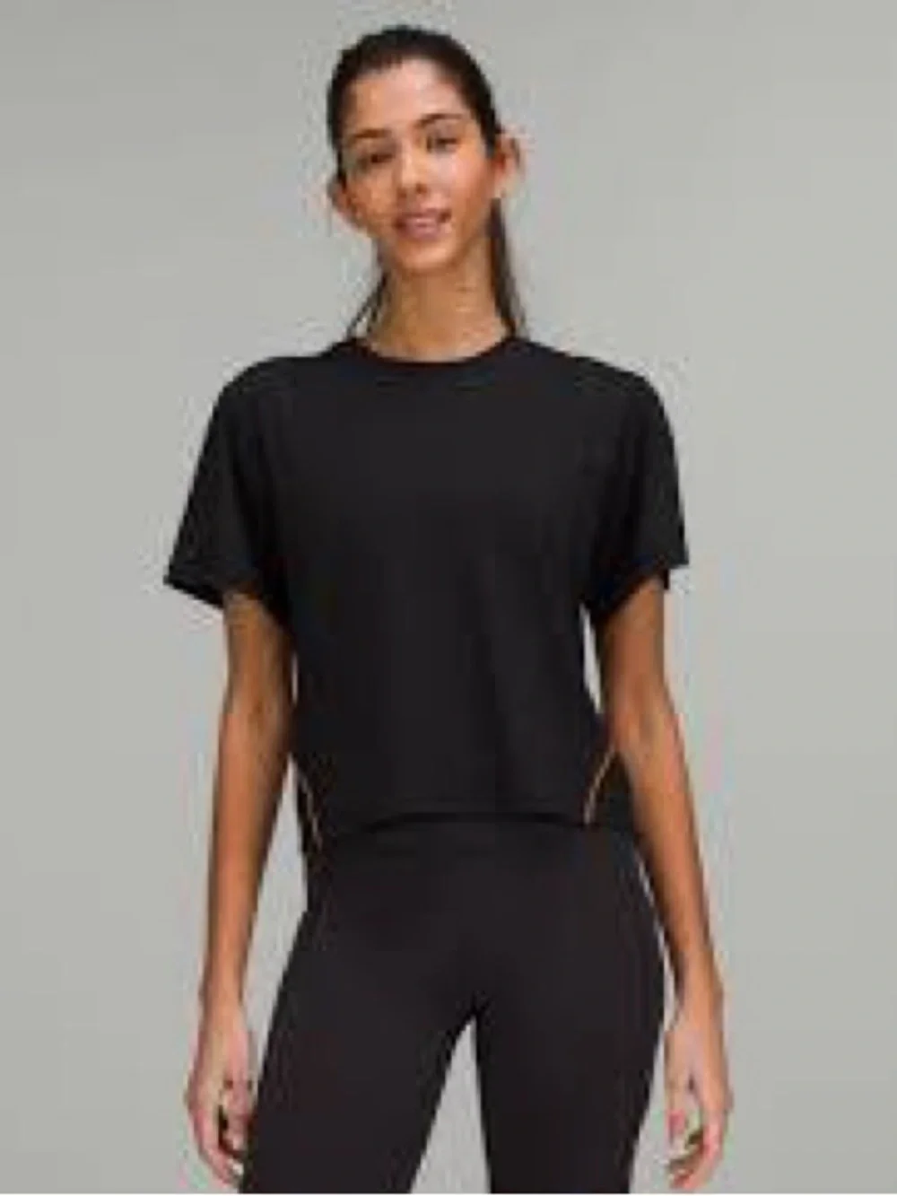 Lululemon Ventilated Open-Back Training T-Shirt in Black with Orange Soda trim